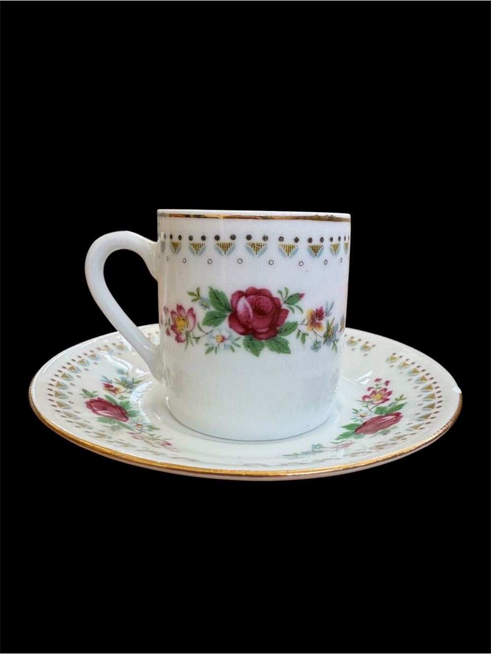 Vintage Espresso Cup and Matching Saucer. White Porcelain with Floral Motif.